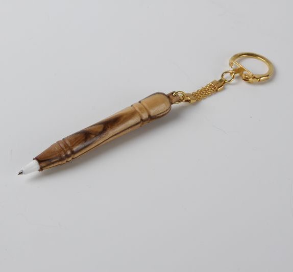 Wooden pen on medal shape